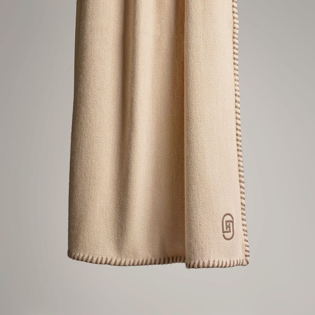 CASHMERE THROW WITH LEATHER DETAIL · SAND