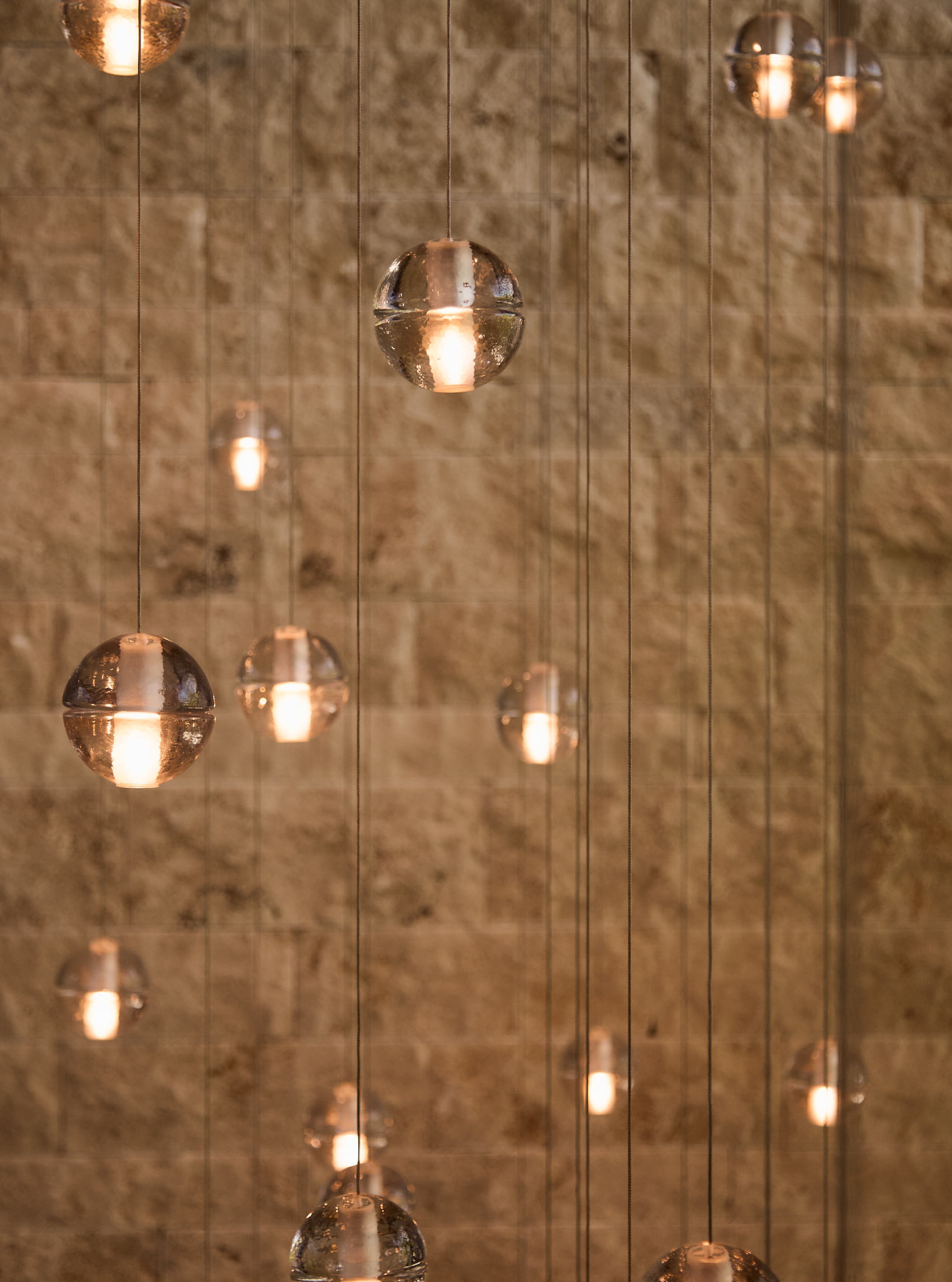 Villa W — Glass pendants stone wall