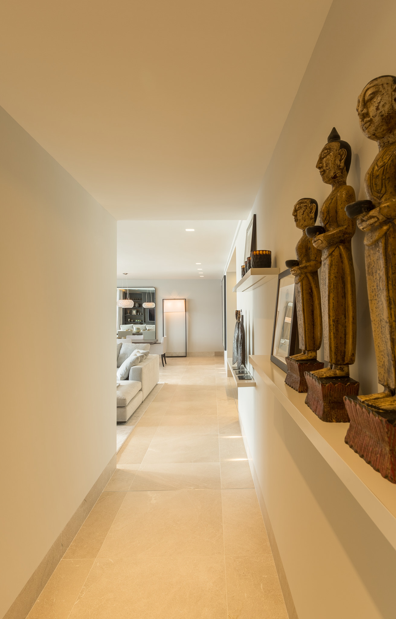 Apartment CA — Hallway buddha sculptures