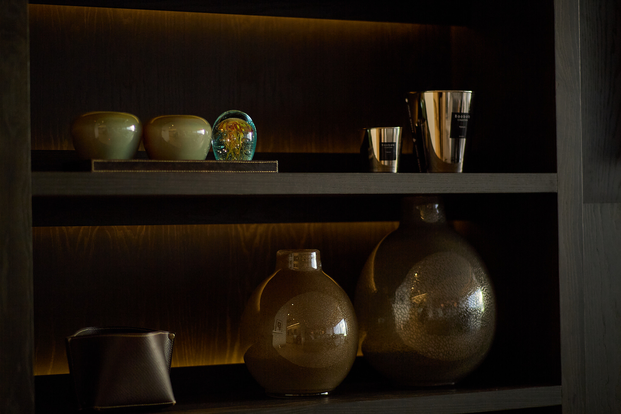 Penthouse CA — Dark shelf vases closeup