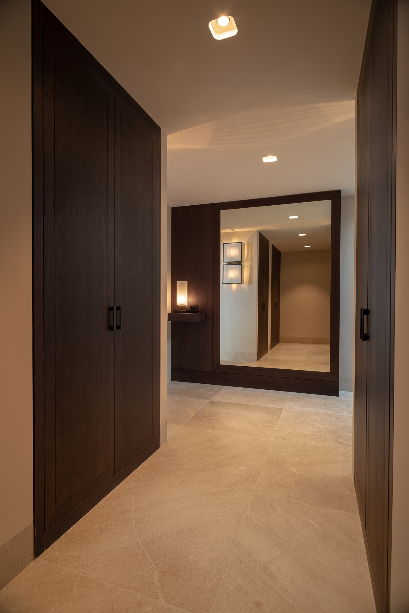 Penthouse CA — Entry dark wood mirror